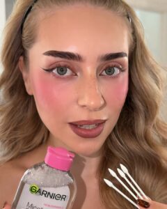 Sharp black winged liner with micellar water and cotton buds ready for the reverse spiderweb